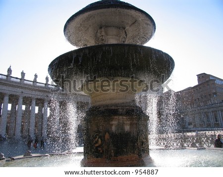Water overflowing at a fountain in the plaza of the Vatican city near rome