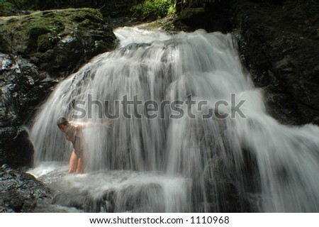 Sexy female model posses in and around waterfalls of Costa Rica