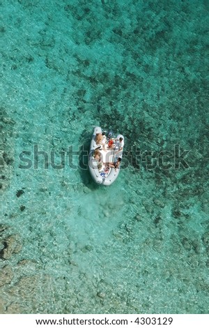 boat in clear coral waters
