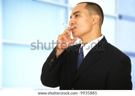 business man taking a smoke break in office hallway