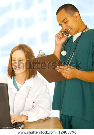 two medical staff doing various things. the doctor sit on desk and working on computer while the nurse on the phone and holding clip board