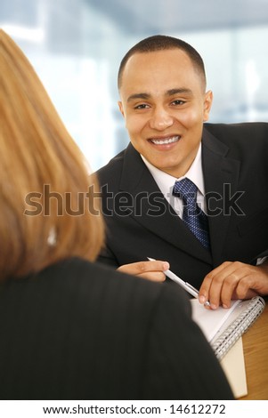 business man smiling while talking to business woman. concept for business deal, meeting, sales, or consulting