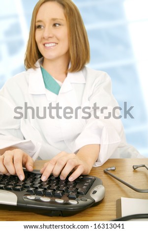 doctor woman typing on computer keyboard. focus only on her hand and keyboard