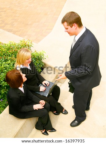 business team having informal discussion outdoor in the park area
