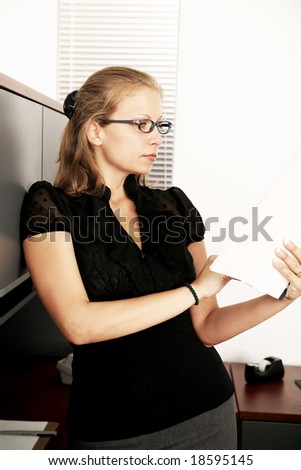 beautiful caucasian secretary working in her office