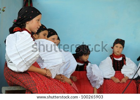 SIC, ROMANIA -AUGUST 24, 2011: unidentified Children between the age of 6-10 are performing in traditional clothes at the Sic Village Festival Days, at August 24, 2011, in Sic (Szek), Romania