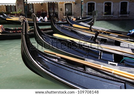 VENICE, ITALY - AUGUST 2: Tourists on a Gondola, August 2, 2012 in Venice, Italy. The city has an average of 50,000 tourists a day and it\'s one of the world\'s most internationally visited city