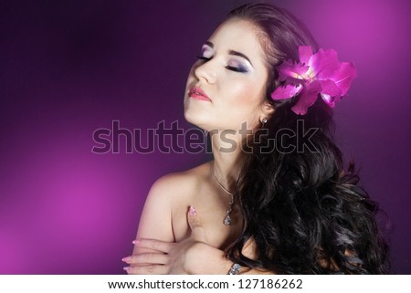 girl with orchid flower in her hair