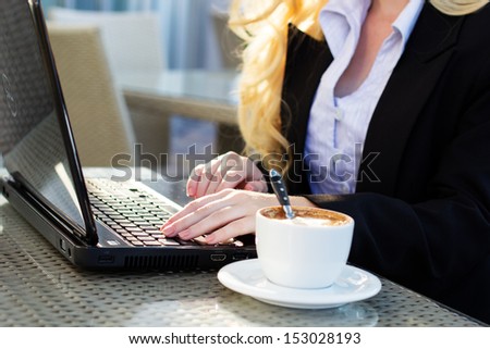 Young pretty business woman with notebook