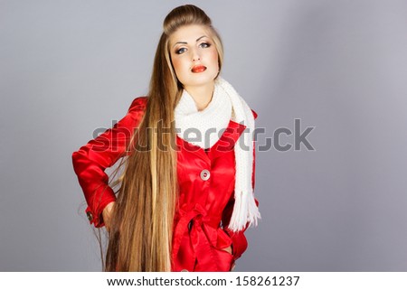 Fashion model dressed in red raincoat