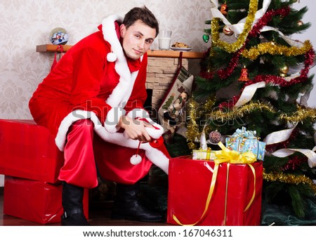 Young man wearing like Santa clause. Christmas