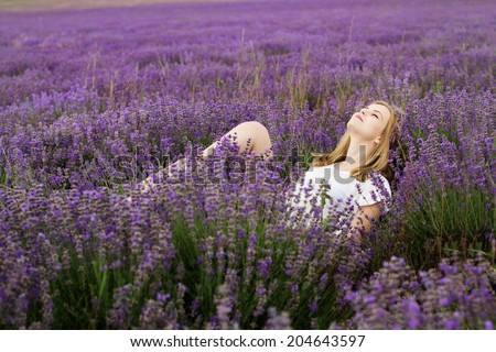Adorable girl in fairy field of lavender