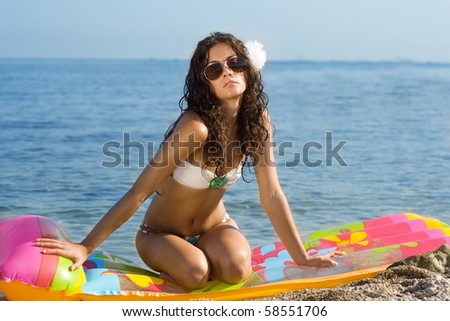 Woman relaxing on an air mattress