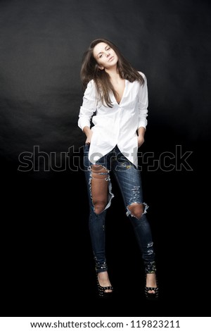 fashion model wearing blue jeans and white shirt