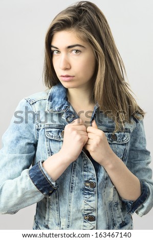 young female fashion model wearing blue jeans jacket