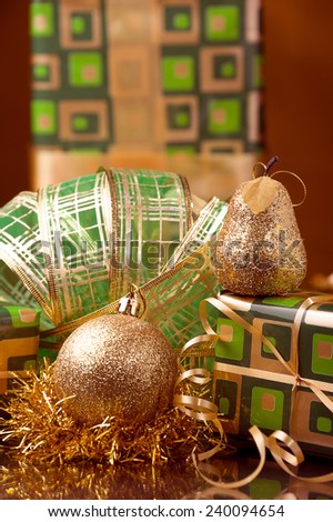 green Christmas gift boxes and Xmas golden decoration ball and golden and green  garland