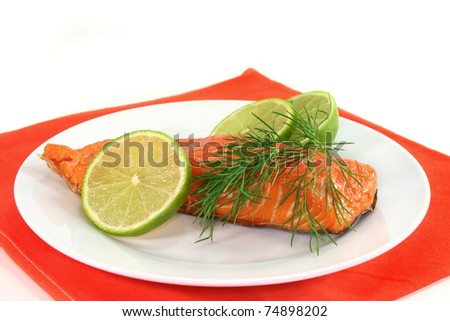 Smoked salmon with lime and dill on a plate