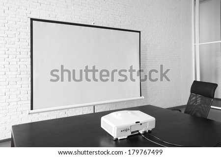 Projector and big screen in office