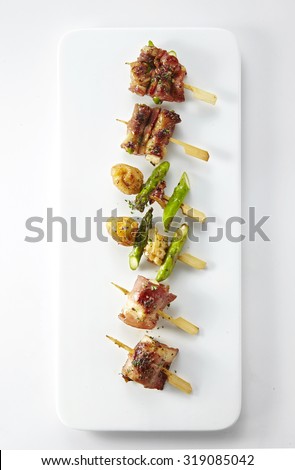 Delicious Western food,grilled meat and vegetables isolated on white plate