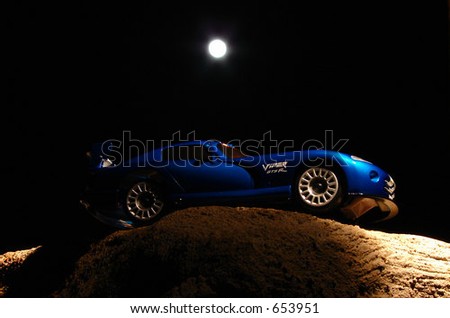 Blue Dodge Viper Under the Light of a Full Moon