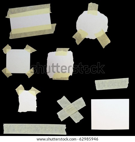 set paper scraps and masking tape isolated on black background