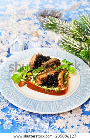Tasty food  beluga caviar on a bread for holiday and Christmas decor