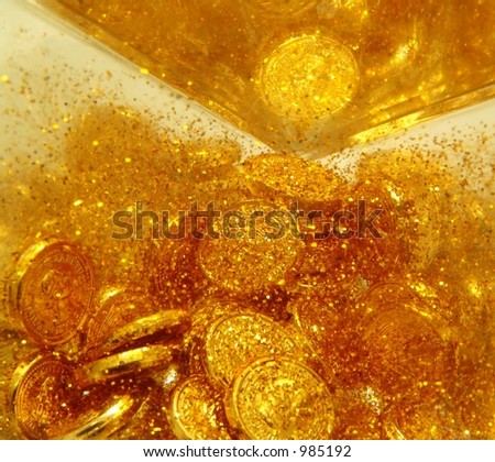 Gold sand and gold coins