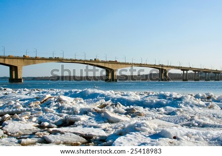 Spring.  Drifting Ice on river. Bridge