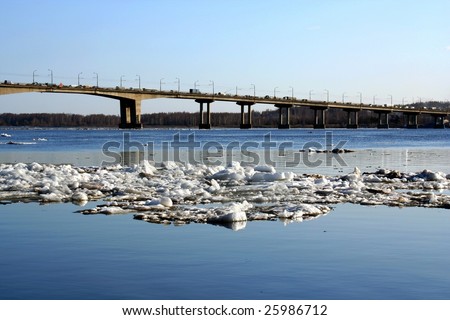 Spring.  Drifting Ice on river. Bridge