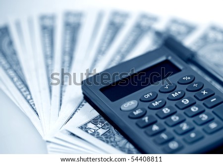 The American money dollars. Bundle of bank notes  and calculator