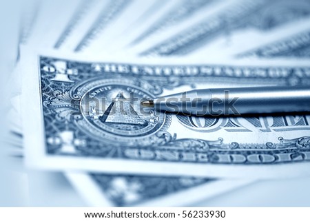 The American money dollars. Bundle of bank notes  and pen