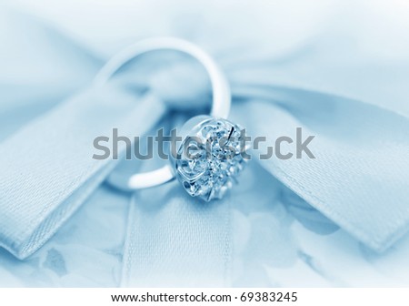 Elegant jewelry ring with  brilliants,  toning in blue color, soft focus