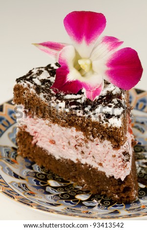 Tasty baking celebratory fancy cake  with flower orchid