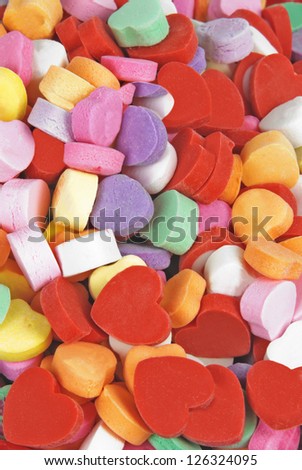 valentines day Candy hearts and rubber heart shaped erasers full frame background.