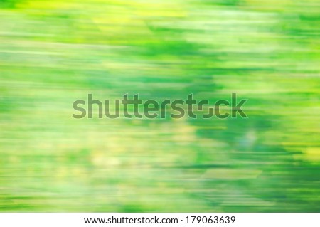 Abstract blured green background with yellow spot