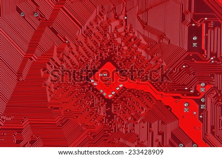 Close up of a printed red computer circuit board