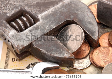 Making money, coin, dollar and wrench concept