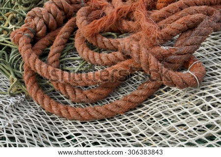 Fishing nets and hawser in harbor
