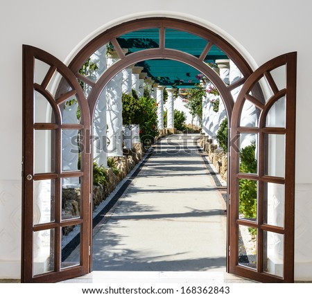 open door arch with access to the alley