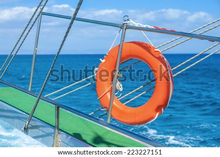 lifebuoy hanging  raised the ladder to sail a ship at sea