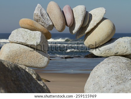 arch of granite stones on a background of sea