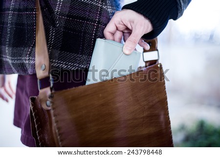 Pickpocket Stealing a Wallet from a Leather Bag