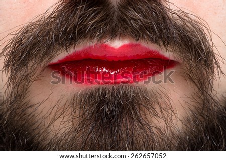 Man\'s Mouth with Red Lipstick on His Lips and Brown Beard