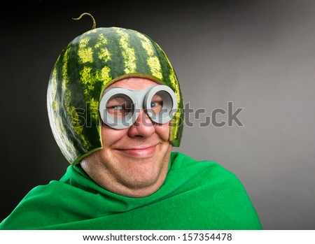 Funny man with watermelon helmet and googles looks like a parasitic caterpillar