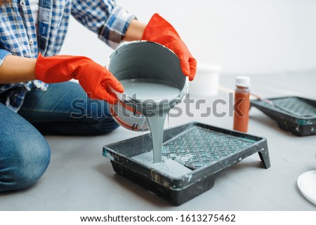 Similar – Image, Stock Photo Cheerful woman preparing paint during renovation