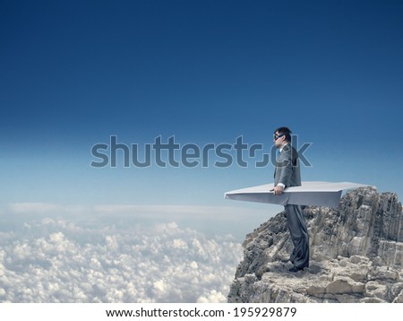 Businessman flying on paper plane
