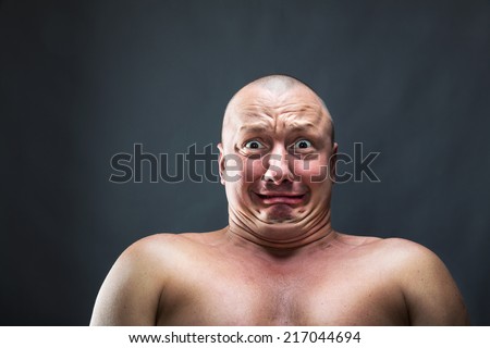 Portrait of bald scared man