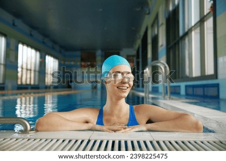 Image, Stock Photo Slim woman wearing swimming cap in pool