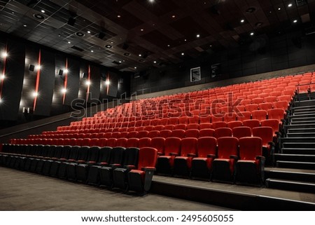 Similar – Image, Stock Photo Row of seats in the theatre with focus on one armrest