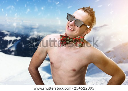 Summer man in winter mountains